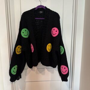 Dressed in LALA black sweater with smileys